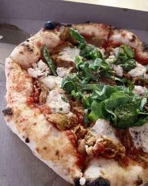 Vegan pizza with Italian "sausages", cashew cheese and pesto at 2022_place - Pop Up in Yerevan