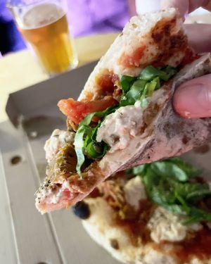 Vegan pizza with Italian "sausages", cashew cheese and pesto at 2022_place - Pop Up in Yerevan