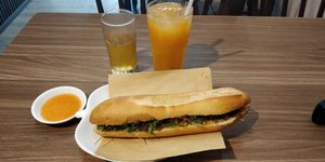Mushroom Banh Mi with nut pate, & spicy sauce on the side at Lian Hua Vegetarian in Hanoi