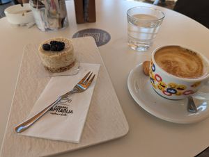 Cappuccino with soy milk and rafaelo raw cake at Kavarna Kapitanija in Koper