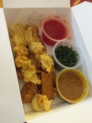 Mixed starter, satay skewers, wonton, chkn (on a lollipop stick), prawn style and crispy seaweed. Satay sauce and spicy sweet and sour. at Wawin Vegan Chinese in Nottingham