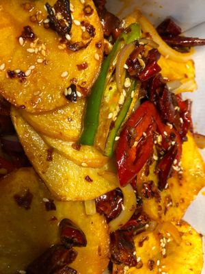 Dry Pot Potato Slices is a bold, aromatic dish featuring sliced potatoes stir-fried to perfection. With crispy edges, tender centers, and rich spices, it’s full of flavor! 🥔 at Kungfu Kitchen in Reading