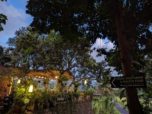 Next to motorbike parking, sign outside at Cepik Villa in Karangasem