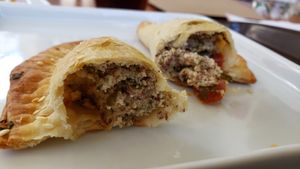 Interior of mini pastel de ricotta caju (R$9). Nice shell but dry filling. at Matuta Queijaria Vegana in Sao Paulo