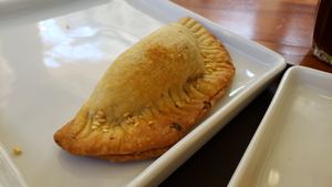 Mini pastel de ricotta caju (R$9). Nice shell but dry interior. at Matuta Queijaria Vegana in Sao Paulo