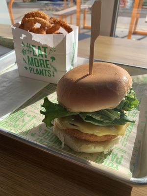 Chick’n Bacon Ranch Burger + Onion Rings  at Next Level Veggie Grill in Denver