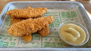 Tenders with spicy mustard   at Next Level Veggie Grill in Denver