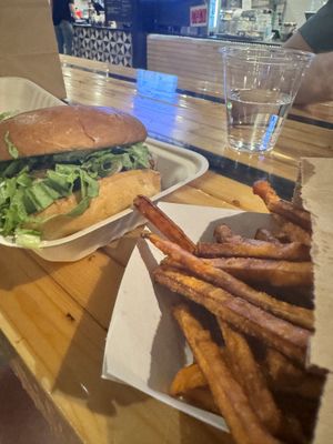 Burger and sweet potato fries   at Next Level Veggie Grill in Denver