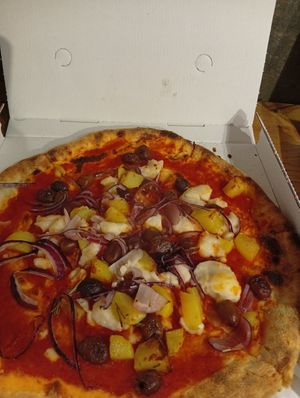 Rice mozzarella olives, onion and more at Nevodi PizzaLab in Venice