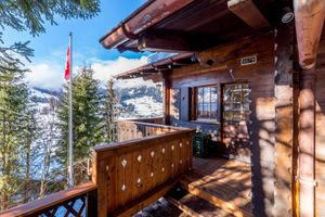 Balcony at the front of the upstairs apartment at Chalet Chez Teddy in Lenk Im Simmental