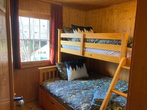 Second bedroom in upstairs apartment at Chalet Chez Teddy in Lenk Im Simmental