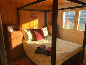 Bedroom in downstairs apartment at Chalet Chez Teddy in Lenk Im Simmental