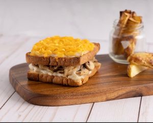 Croc Monsieur 
Caramelized onions, béchamel, mushrooms, organic sourdough bread and vegan cheese  at Pumpkin and Kale  in Dubai