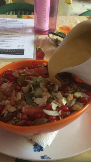 Vegan deluxe muesli breakfast with saffron rice milk "yoghurt"  at Honey and Spice in Pushkar