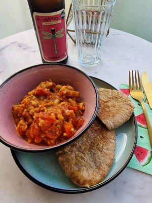 Cauliflower curry with cheezy garlic pitta bread  at The Happy Shroom in Gloucester