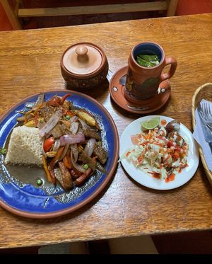 Coca tea, salad, and look saltado  at El Encuentro - Tigre in Cusco
