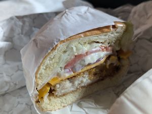 Fish burger packed with ingredients at Dope Vegan in West Palm Beach