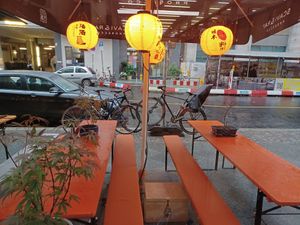 Outdoors seating area in the rain at Beyond Ramen in Berlin