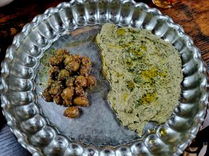 Marinated olives and spinach and garlic dip at Mana's Plant-Based Persian Cuisine in London