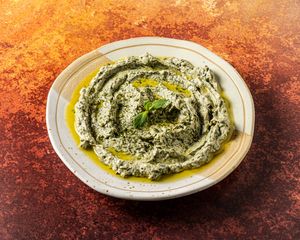 BORANI ESFENAJ.
Strained spinach yoghurt dip with
garlic & black pepper. at Mana's Plant-Based Persian Cuisine in London