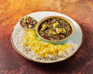 GHORMEH SABZI.
The Queen of Stews: parsley, coriander, chive & fenugreek stew, plant-based ‘chicken’, red kidney beans, infused with black limes. at Mana's Plant-Based Persian Cuisine in London