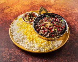 FESENJOON.
A rich, sweet & savoury ground walnut and pomegranate stew with oyster mushrooms . at Mana's Plant-Based Persian Cuisine in London