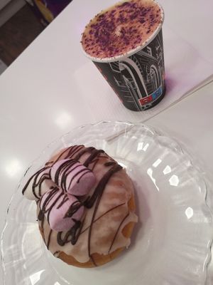Cappuccino with oat milk and vegan donut filled with mousse au chocolate at Divina Berlina in Tenerife