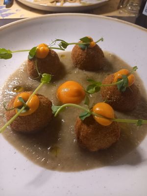 Zucchini/ courgette meters balls with aubergine crem. at I Morgante Bottegabistro in Agrigento