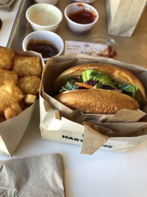 Chick n deluxe with tater tots and fries don’t forget the sauces  at Hart House - Sepulveda in Los Angeles