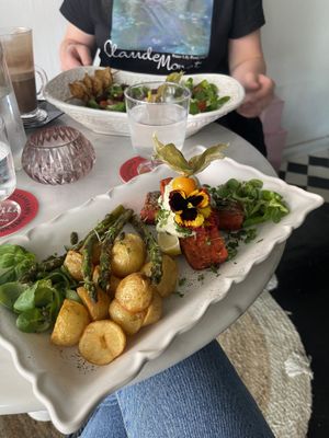 Vegan salad with chicken skewer and vegan salmon with potatoes   at Pink Lettuce in Chester