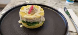 A typical appetizer in Peruvian gastronomy, a dish made with potatoes, limes, chickpeas, yellow hot pepper sauce stuffed with avocados, onions, peas, and celery filling mixed with" at Andean Garden - Cloud Kitchen - Maybe closed in Brooklyn