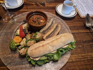 Main course (lunch platter) with mushroom demitasse potage soup, carrot rapé and avocado sandwich, soy meat wraps, fried plantain, grilled vegetables, and soy meat/bean chilli at Cafe Banmari in Mishima