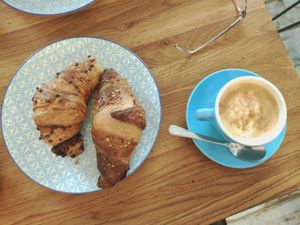 Vegan chocolate croissant, blueberry croissant and oat cappuccino at Coffee Junkie in Vienna