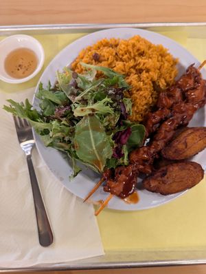 Sampler plate with pinchos (bbq chicken skewers). Hot sauce on the side in a little dish, that was really good too! at Casa Borinqueña in San Francisco