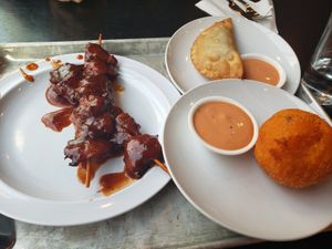 BBQ chicken Pincho, Lulu's Famous Pastelillo (Impossible beef), and Relleno de papa. Yum! at Casa Borinqueña in San Francisco