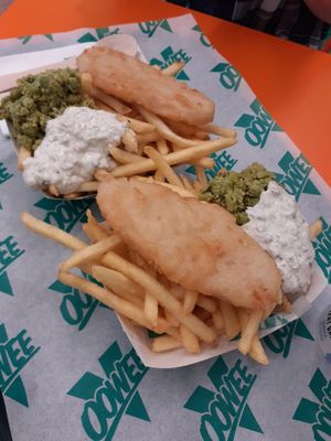 fish and chips £7.95 - mushy peas were really good, had mint or something in. 'fish' was nice enough and good portion size.  at Oowee Vegan in Brighton