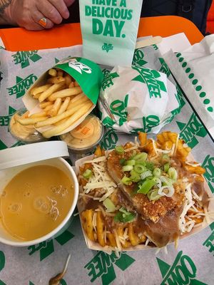 Sneaky clucker & fries, cheeze sauce and loaded chick'n waffle fries at Oowee Vegan in Brighton