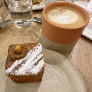 A delicious oat milk cappuccino in the cutest mug ☕️   at Holy Llama - Sintagma in Athens