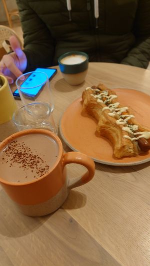 Puffy Dog + oat chocolate + cappuccino (single) at Holy Llama - Sintagma in Athens