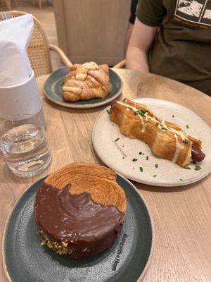 Almond croissant, hotdog puff and pistachio wheel  at Holy Llama - Sintagma in Athens