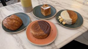 Pain Au Chocolat, Wonder Wheel Vanilla -Caramel, Wonder Wheel Pistachio, Praline Cruffin at Holy Llama - Sintagma in Athens