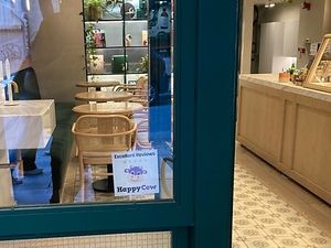 Happy cow sticker on the front window!  at Holy Llama - Sintagma in Athens