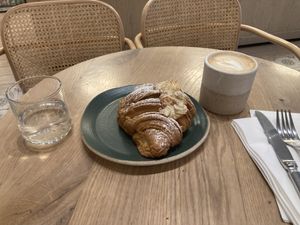 Almond croissant and pea milk cappuccino   at Holy Llama - Sintagma in Athens