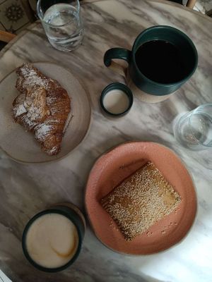 Almond croissant & mushroom pastry. at Holy Llama - Sintagma in Athens