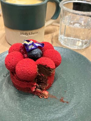 Red confessions and a café latte with oat milk. at Holy Llama - Sintagma in Athens