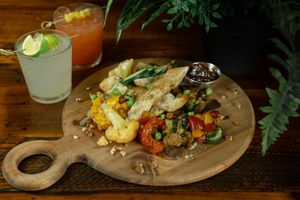 Faire Roti (Sharables) - House selection of roasted and cured vegetables, olives and artisan bread. at Roots in Riverside