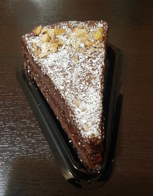 A piece of cake baked by and brought from Vegan House at Vegan House in Ulaanbaatar