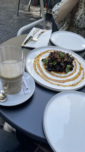 oat milk latte and eggplant starter  at Elaine's Greenhouse in Frankfurt