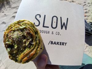 Pesto Bun (first i thought it's pistachio) but very delicious! at Slow Sourdough & Co in Almada