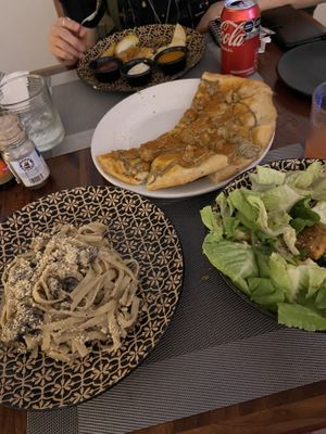 Mushroom pasta, Thai salad, three cheese pizza, potato wedges  at CASA AÜA MÉRIDA in Merida